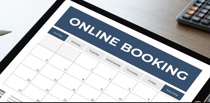 Image of a tablet with an online room scheduler on the screen.