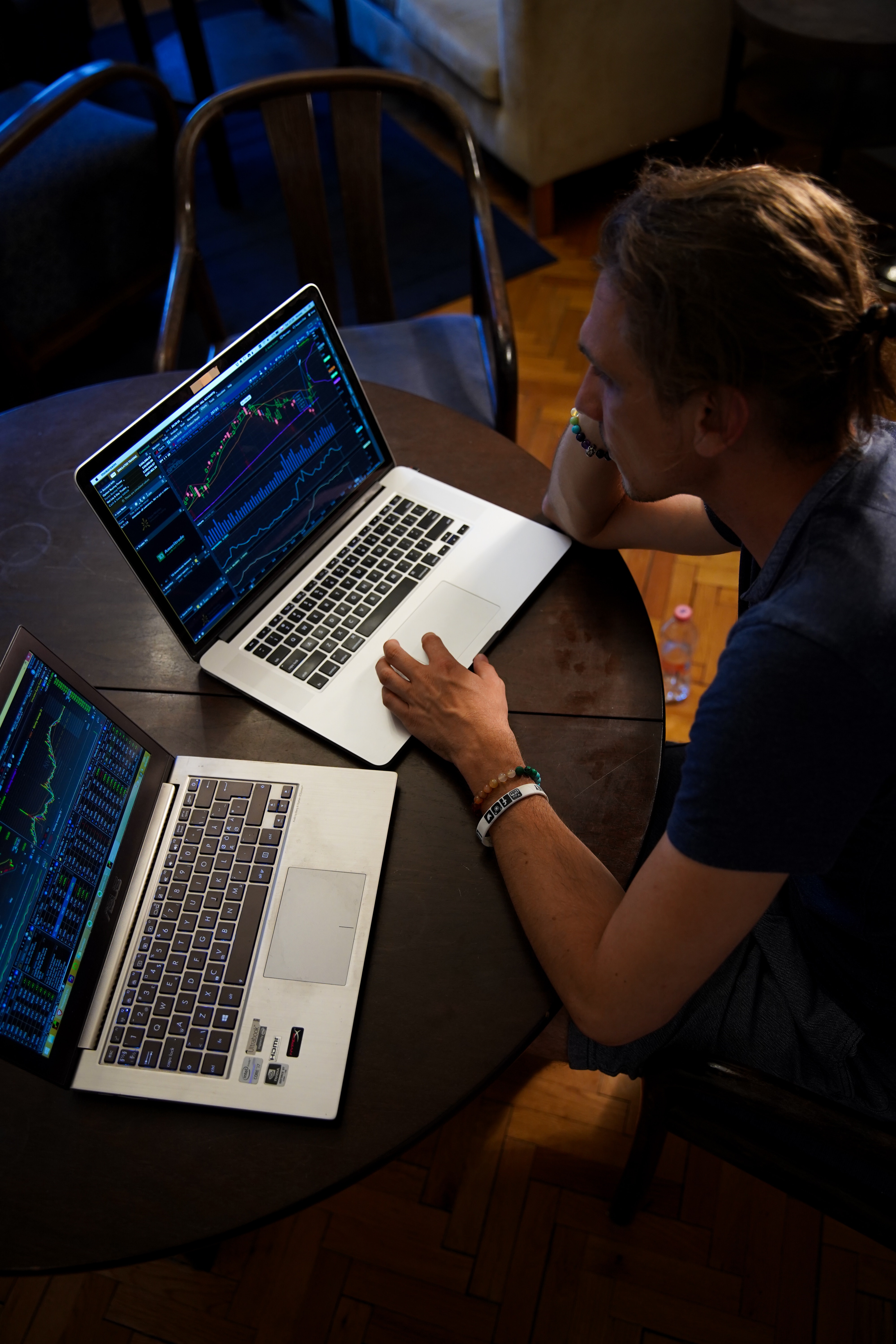 Person sitting at computer looking at market intelligence data