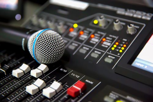 Image of soundboard with microphone.