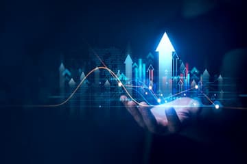 Businessman holding growth graph of business. Successful business, growth strategy and achieving goals with the rising arrow.