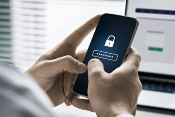 Photo of person holding mobile phone with a password lock on it