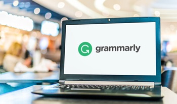 image of grammarly in text with a G in a green circle on a computer