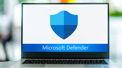 Image of laptop with a shield icon on it and 