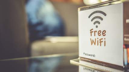 Image of stand on table with a card that reads 