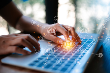 Image of human typing on keyboard with tech images hovering