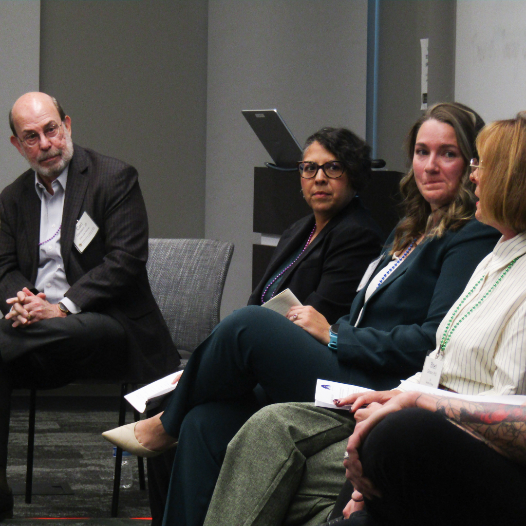 Speakers in a breakout room at the 2025 summit.