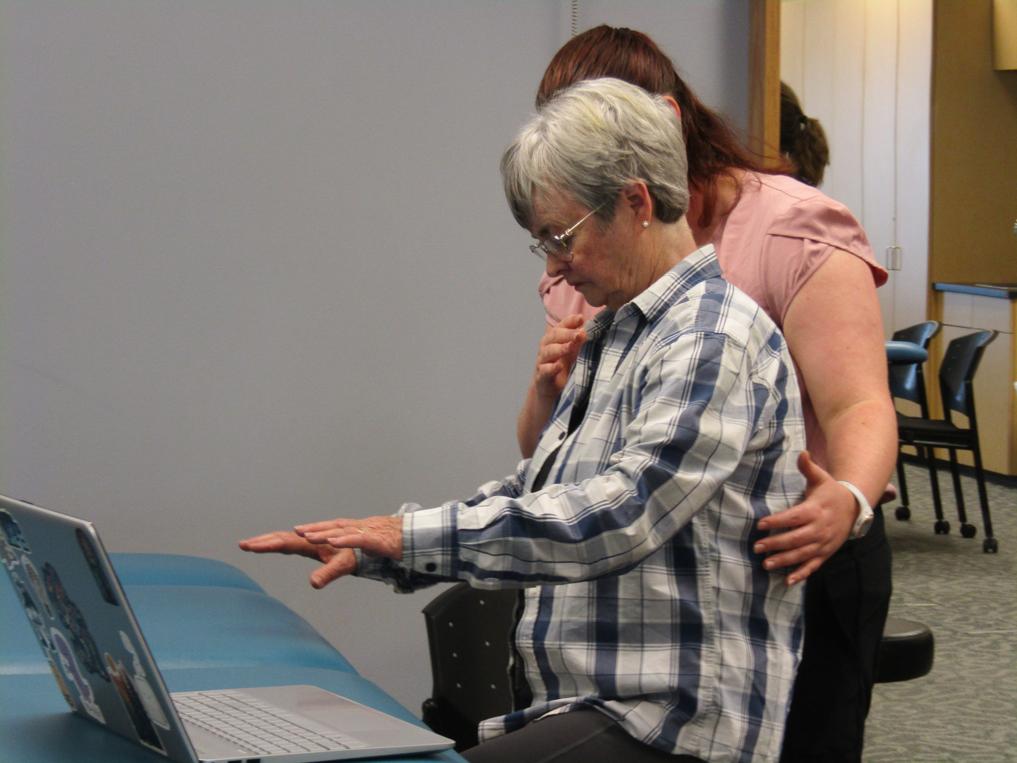 A Geri-Educator and PT member roleplaying a case study.