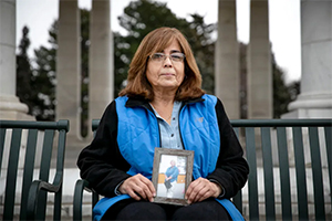 woman sitting on steps outdoors
