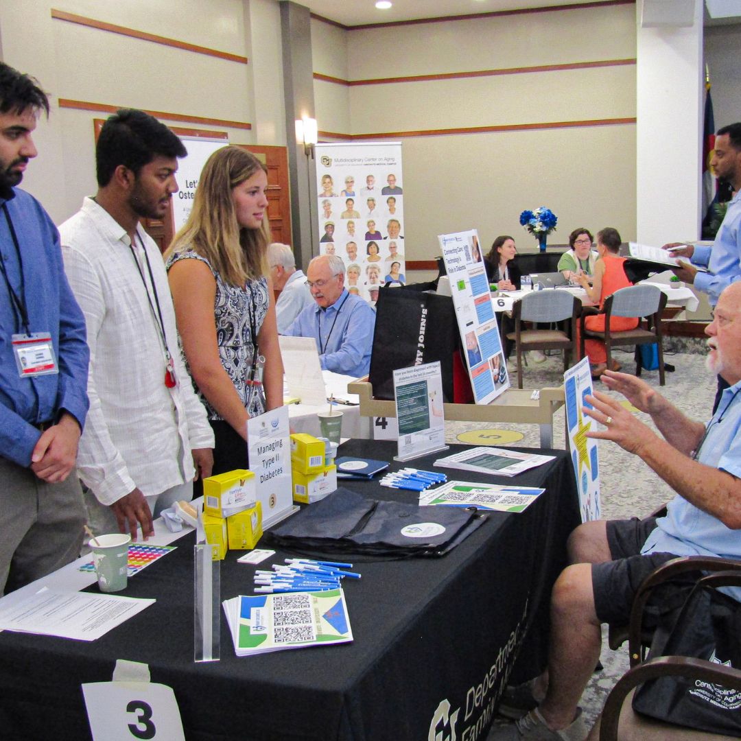 Attendee visiting the Type II diabetes team at the Shalom Park Research Roadshow.