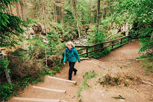 woman hiking on trail