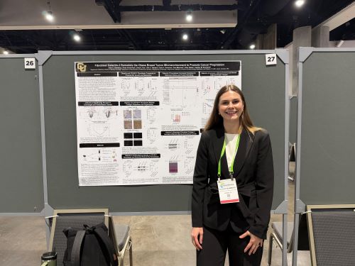 Ellen Bamberg in front of her poster