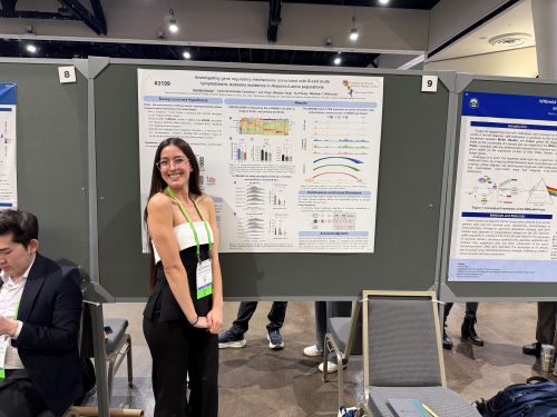Clarissa Garcia in front of her poster