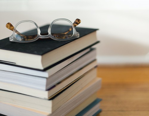 Glasses on stack of books