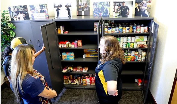 Office of Student Services personnel take stock of the CU Anschutz student food pantry.