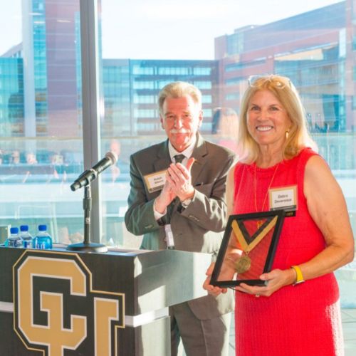 Debra Devereaux accepts her commemorative medallion during the endowed chair celebration event.
