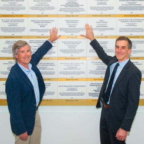 Benefactor and faculty highlight endowed chair plaque on Endowed Chair wall in the Anschutz Health Sciences building.