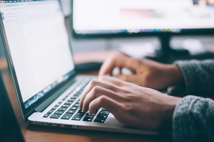 Hands on a laptop computer