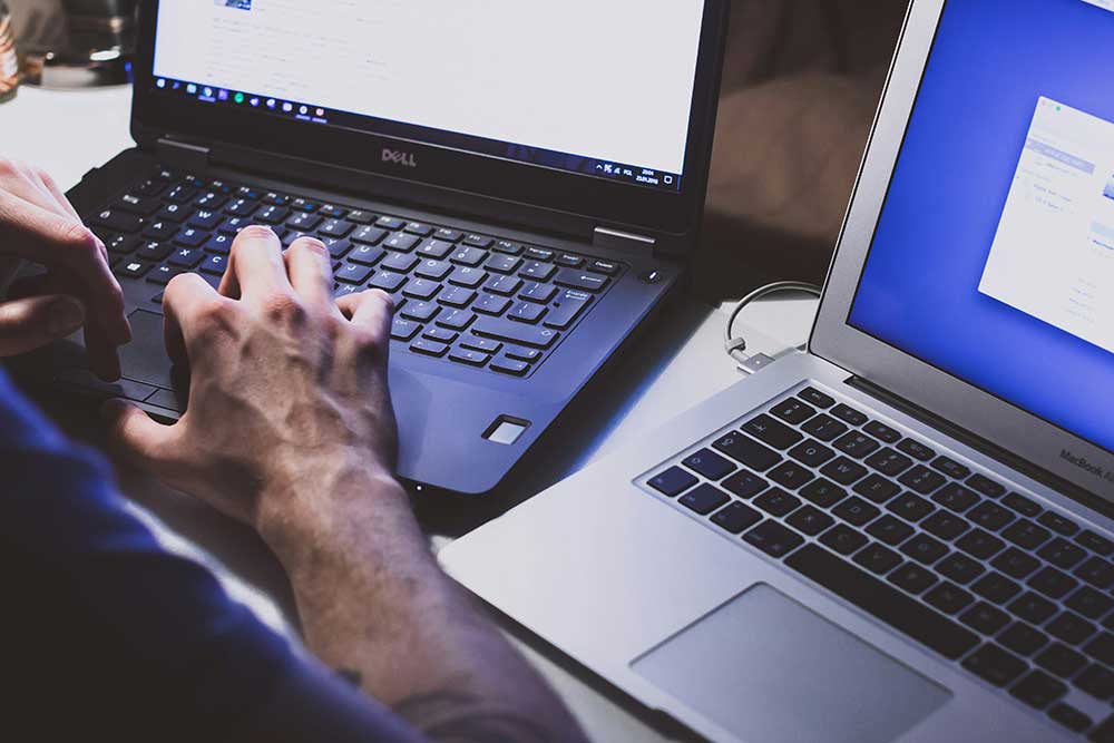 human working on a laptop