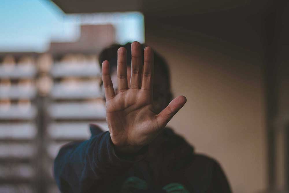 human hand issuing a stopping gesture