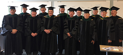 Class of 67 in robes and caps