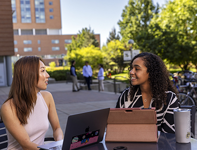 two students talking on campus