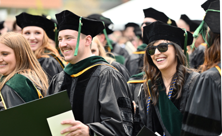 graduates smiling