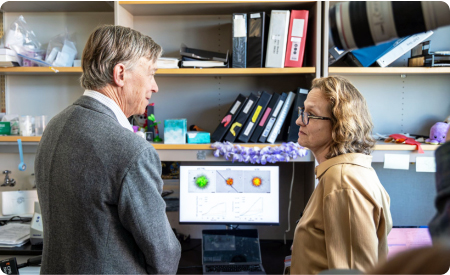 Sen. Hickenlooper in a lab with a researcher