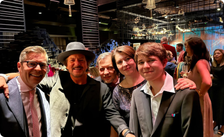 Jamie Feinstein, Eddie Vedder, and researchers Igor Kogut, PhD and Ganna Bilousova, PhD