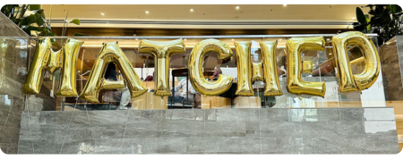 Match Day spelled with gold balloon