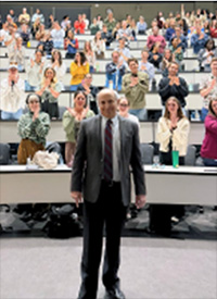 Steve Lowenstein in front of class