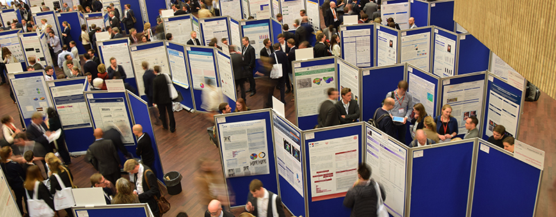 poster session poster session shot from above with blue partitions and people milling about.