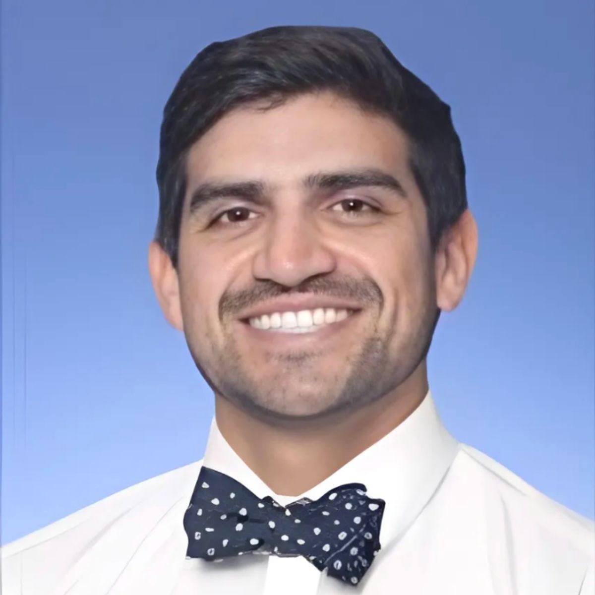 man with dark hair and bowtie