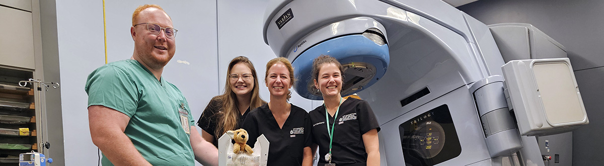 Tristan Seawalt poses with radiation oncology residents/fellows at CSU’s Flint Animal Cancer Center