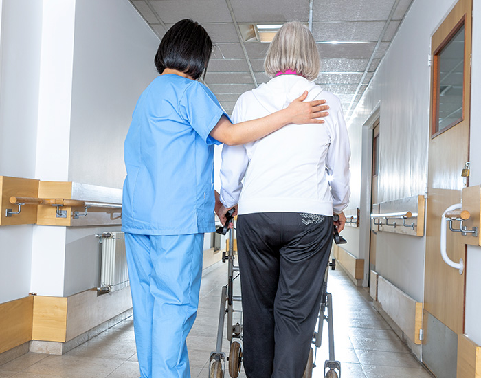 patient getting help walking