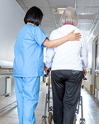 patient and caregiver walking