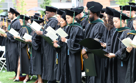 graduates reading oath