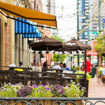 Outdoor seating under umbrellas at a restaurant