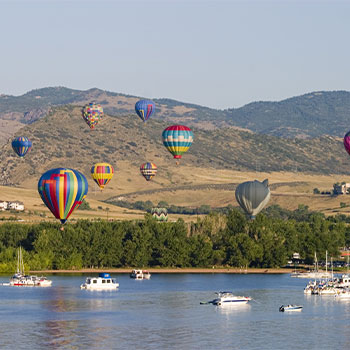 Hot Air Balloons Over a Lake