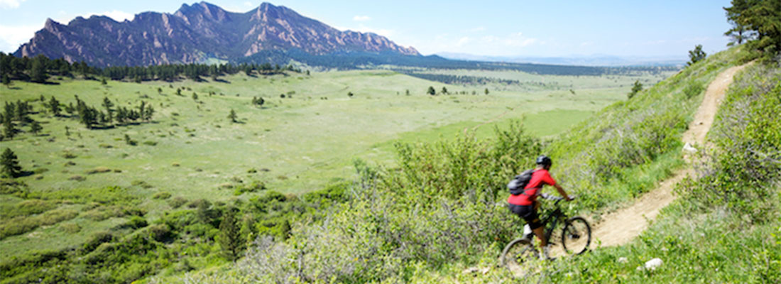 Person Biking in the Mountains