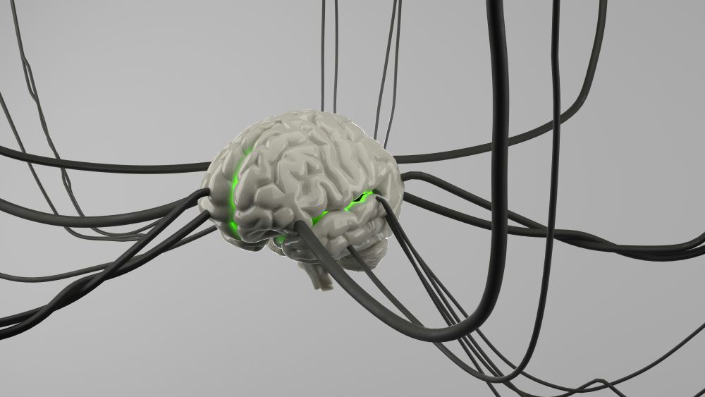 3D render of a brain connected by black wires, glowing green along the center, symbolizing neural networks or advanced technology.