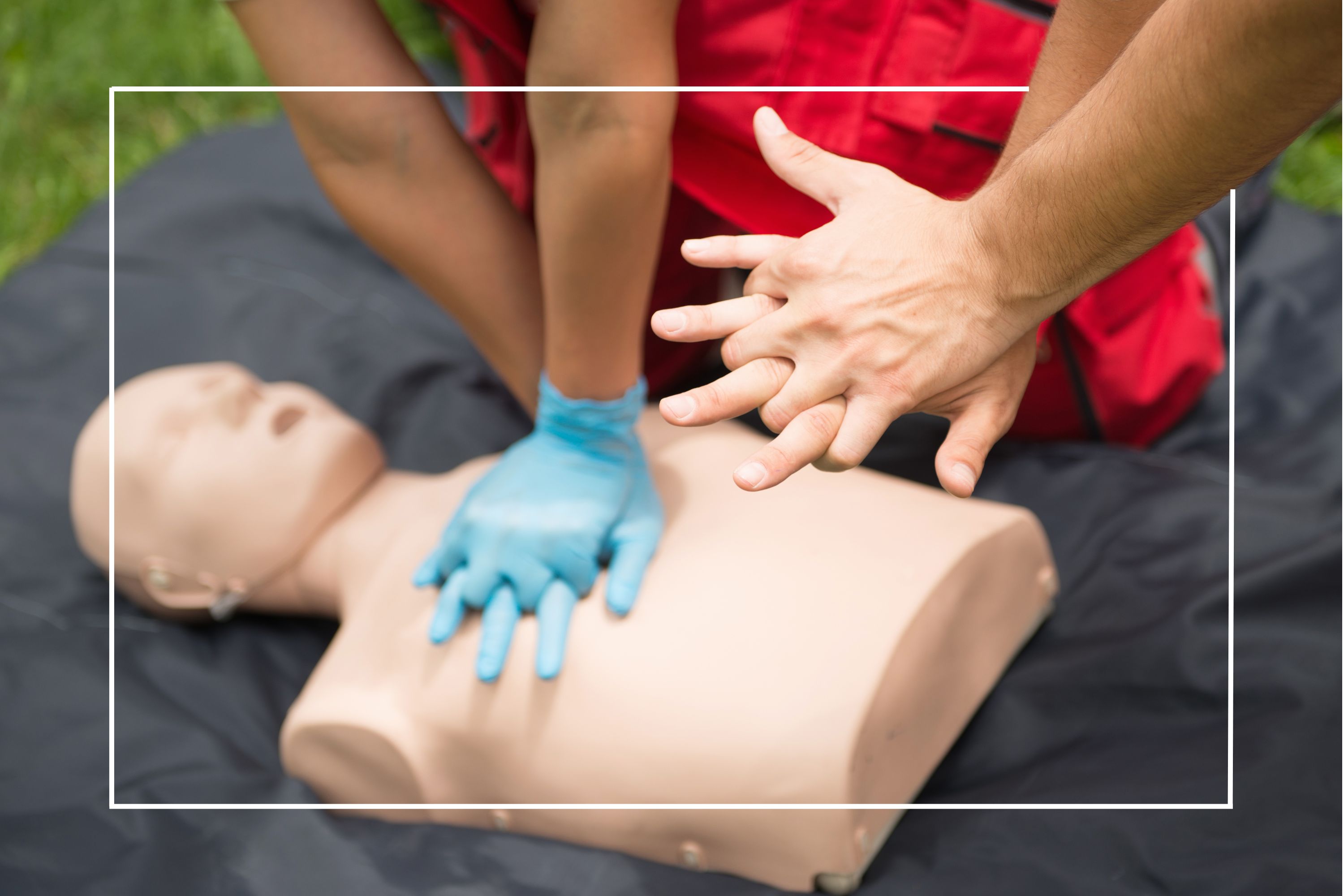 instructor demonstrating chest compressions on a manikin