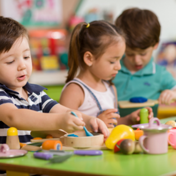preschool Preschool children eating at a table
