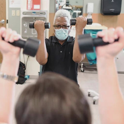 Patient lifts barbells