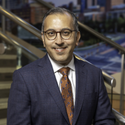 Man in blue suit and copper floral tie