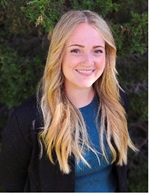 molly naylor blonde woman in a blue shirt with a black blazer