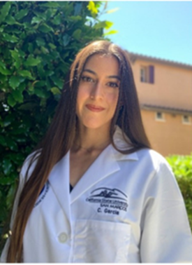 clarissa Garcia, BS Brunette woman in white coat