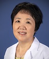Xiao-Jing Wang, MD, PhD An Asian woman with a short haircut in a white labcoat