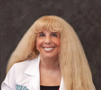 blonde researcher in a white coat