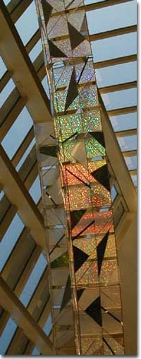 sculpture with glass facade refelecting light