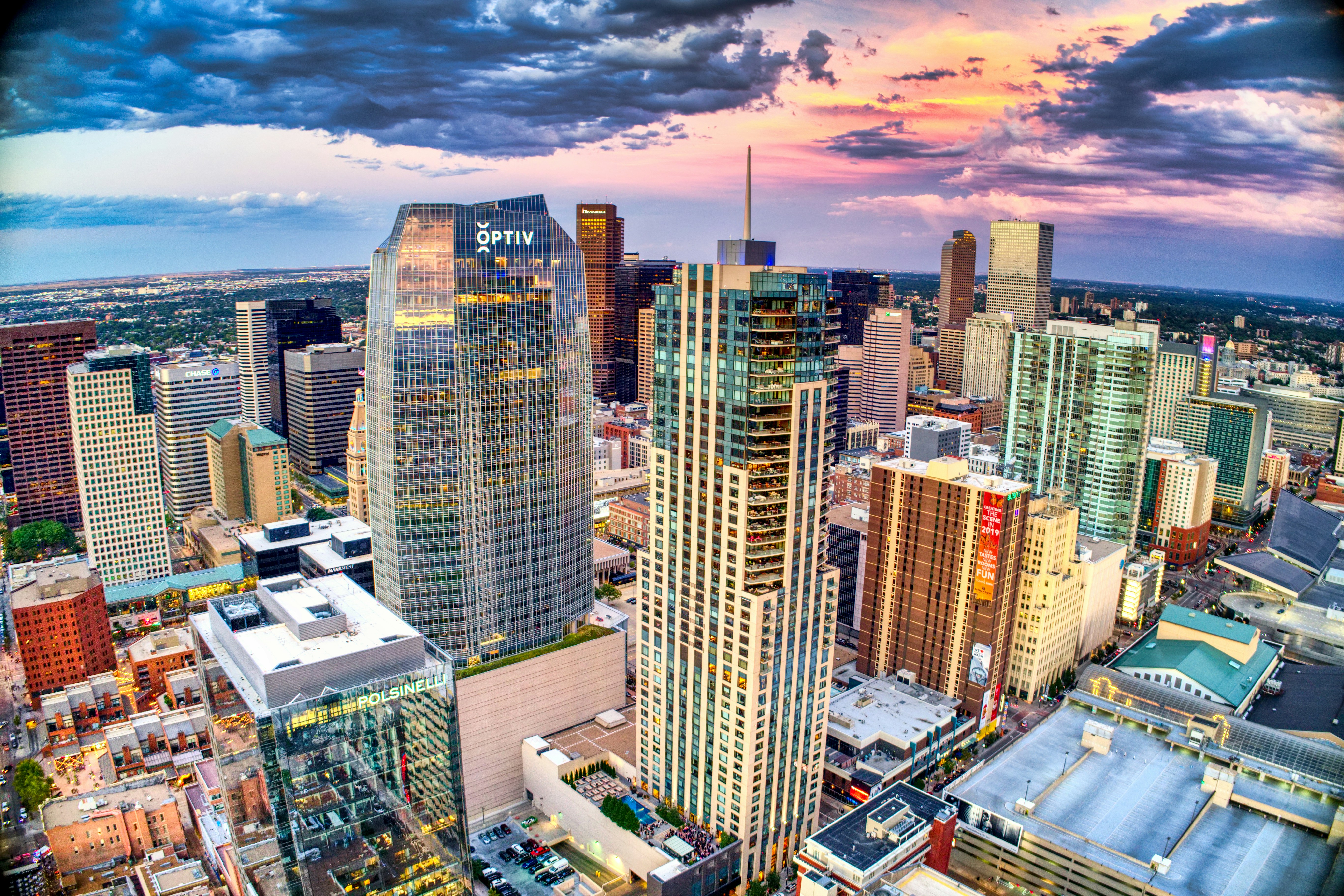 Colorul nighttime aerial photo of Denver's skyline, taken by Acton Crawford